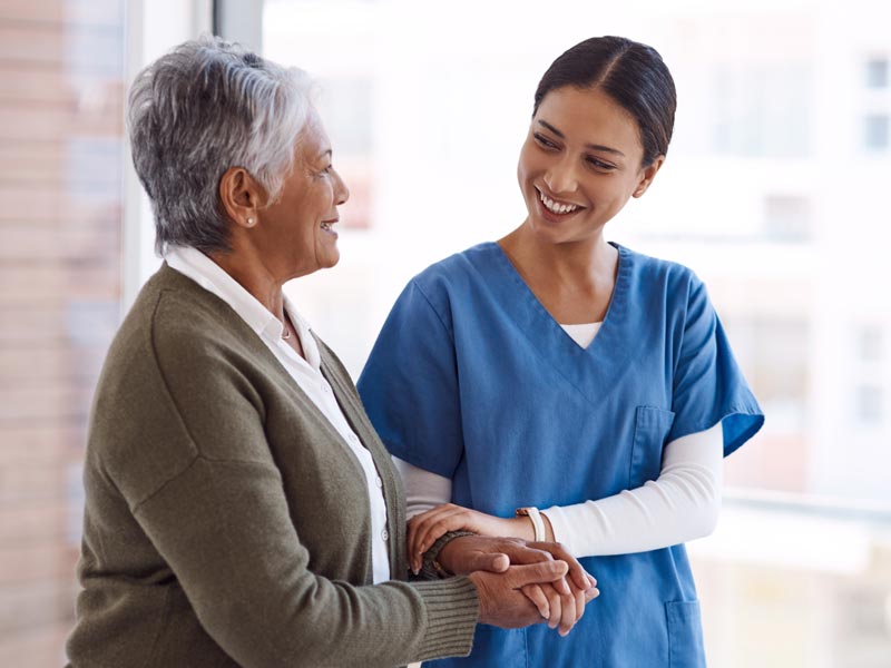 elderly woman with care giver
